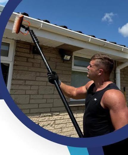 Ash using a water-fed pole on a window-cleaning job